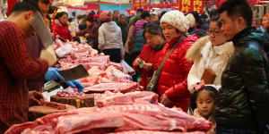 Chinese customers buy pork at a market in Beijing, China, 15 February 2015. The Beijing municipal government is placing 3.05 million kilograms of frozen pork reserves into the marketplace to alleviate a significant surge in prices, the first time the city has taken such an action. The price of pork has been rising since February — raw pork prices surged 50.6 percent month on month in April — with little sign of retreating demand, according to the Beijing municipal government. The government will also provide subsidies of 5 yuan per kilogram of pork sold in 555 major chain grocery stores and subsidies to slaughterhouses to increase the pork supply, Deng Hongbo, spokesman of the municipal commerce commission, said on Tuesday. The measures, which will begin on Thursday (5 May 2016) and continue until July 4, are expected to lower the price by 18 percent, Deng said. Deng said the government will enforce rigid inspection and sanitary standards in each facility providing frozen meat.