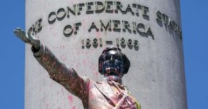 Paint and protest graffiti covers the Jefferson Davis Memorial in Richmond, Va., Sunday, June 7, 2020, following a week of unrest in the U.S. against police brutality and racism in policing. Jefferson Davis was the president of the Confederate States of America during the Civil War. (AP Photo/J. Scott Applewhite)